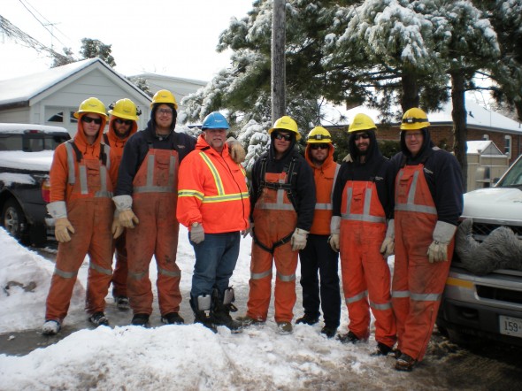 Manitoba Hydro crew arrive at Freeman and Manderly to restore power.
