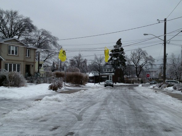 Lynn Road. Wires are hanging so low that somebody flagged them with Loblaws bags