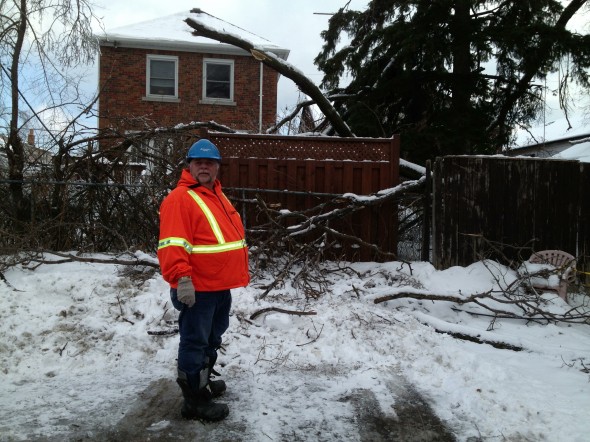 Manitoba Hydro foreman Marvin Roos surveying the damage in the Co-op parking lot.