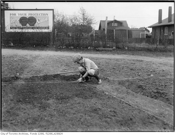 Boy squaring garden plot at Birch Cliff Public School, May 1933. Courtesy Toronto Archives.