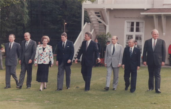 Jacques Deiors, Ciriaco De Mita, Margaret Thatcher; Ronald Reagan, Brian Mulroney, Francois Mitterrand, Noboru Takeshita and Helmut Kohl.