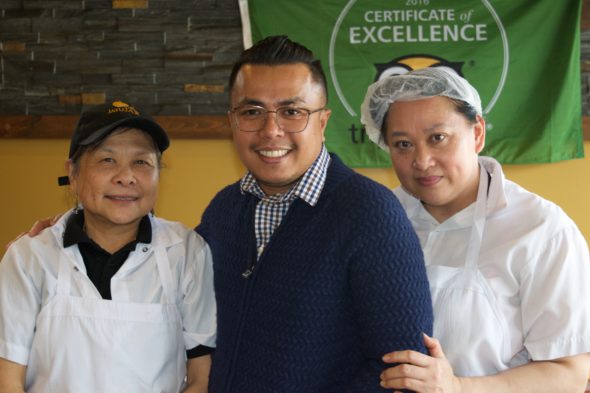 Jatujak co-owner Phanom "Patrick" Suksaen and two kitchen staff members at the Birch Cliff location.